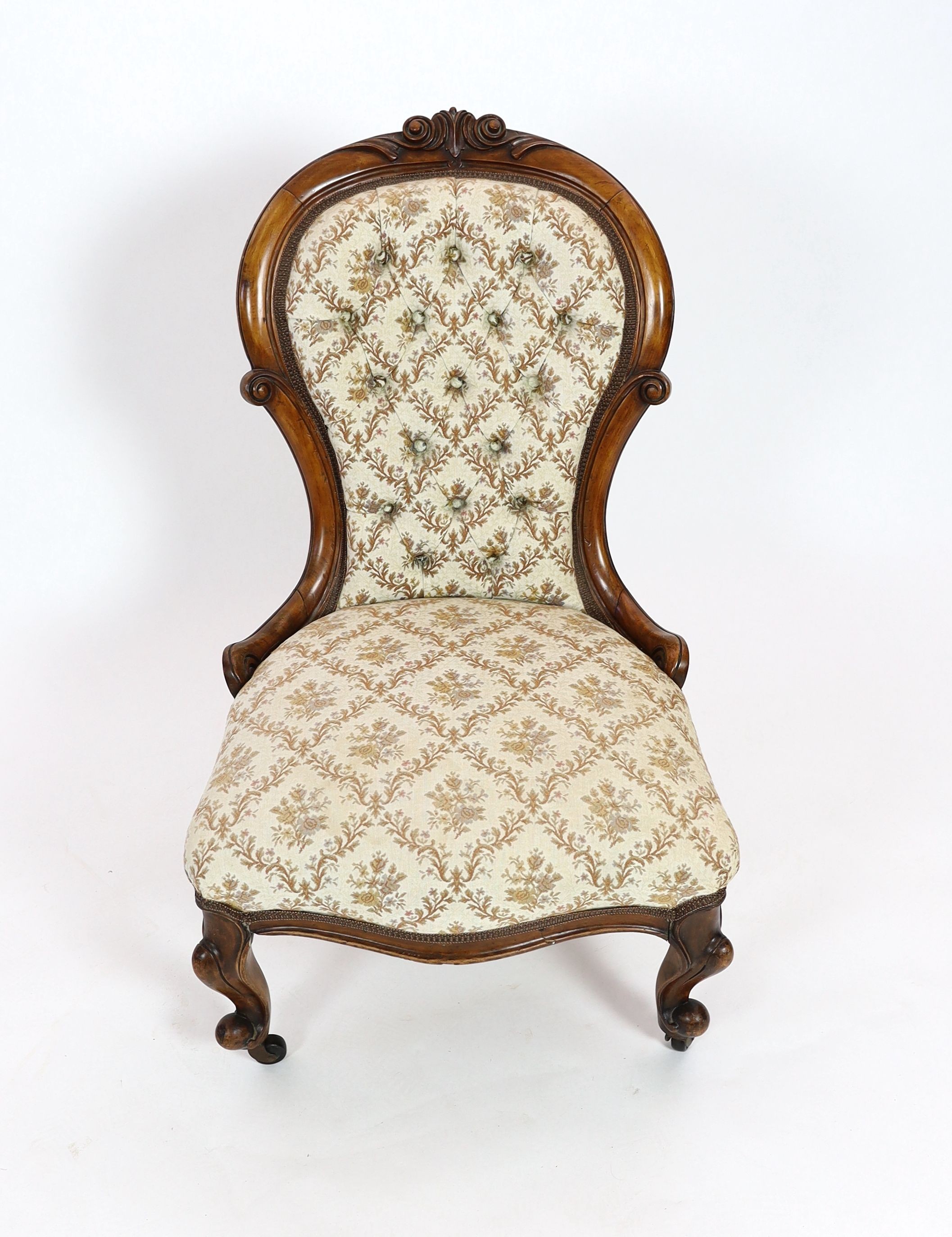 A Victorian walnut spoonback nursing chair, width 57cm depth 68cm height 96cm